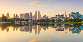Coface Asia Payment Survey 2022. Panoramic view of Kuala Lumpur city waterfront skyline with reflections and beautiful morning sky, Titiwangsa Park, Malaysia. 